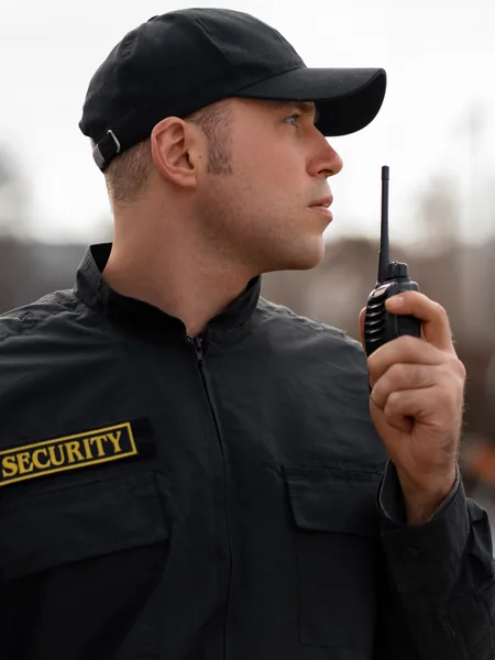 portrait-male-security-guard-with-radio-station